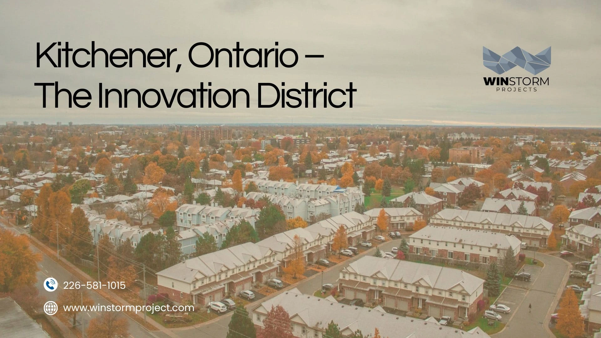 Aerial view of Kitchener's Innovation District with autumn trees, residential houses, and overcast sky. Contact details for Winstorm Projects visible.