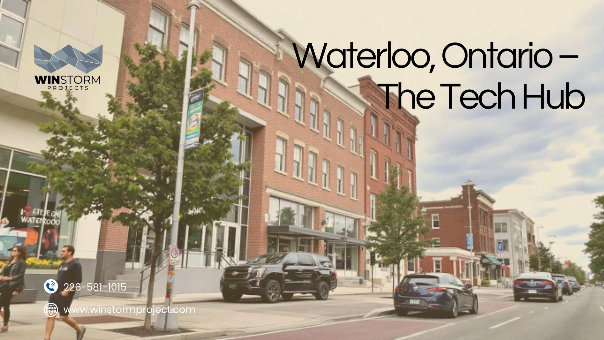 Street view in Waterloo, Ontario with people walking, parked cars, brick buildings, and trees lining the sidewalk under a cloudy sky.